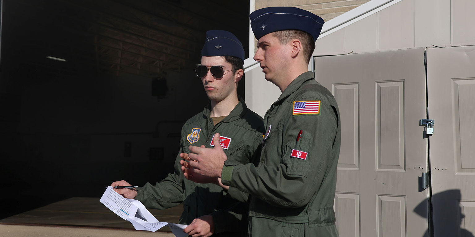 Two cadets discussing orders